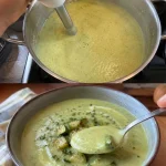 Heerlijke Zucchinisuppe in een kom, versierd met kruiden.